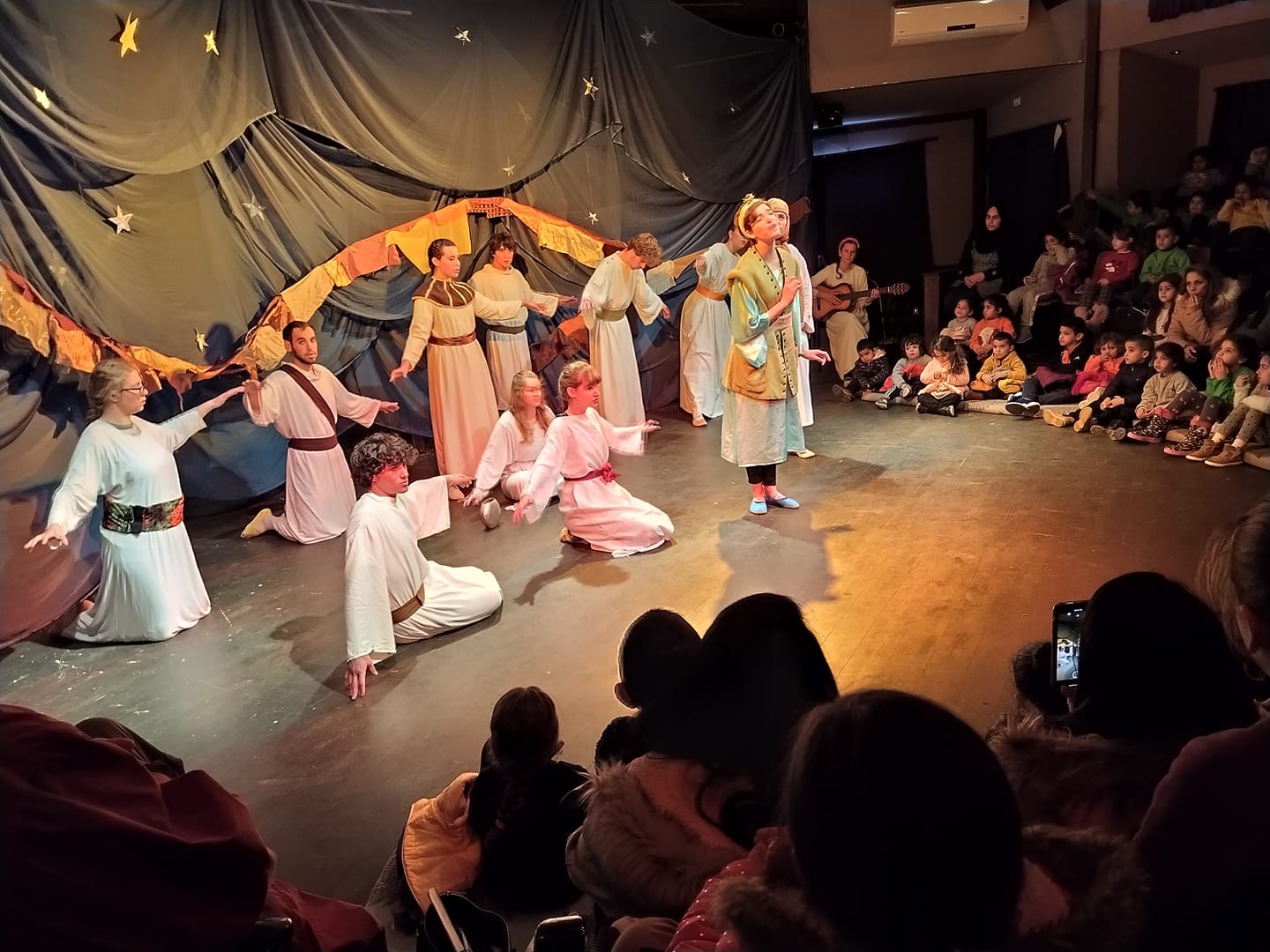 Volunteers performe the Arabic/English/Hebrew theatrical play