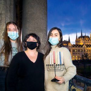 Jewish Agency Israeli emissaries serving in Budapest light Hanukkah candles