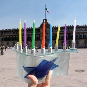 A Jewish Agency Israeli emissary serving in Mexico lights Hanukkah candles