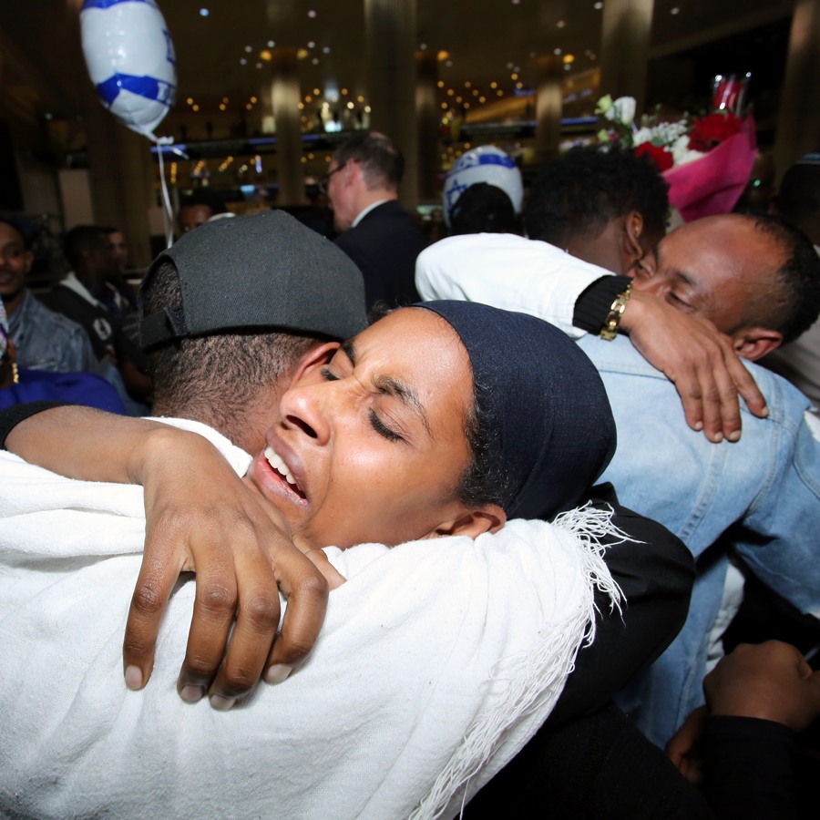 Ethiopian family members hugging after landing in Israel | Photo: Dudi Salem, Zoog Productions, April 2019