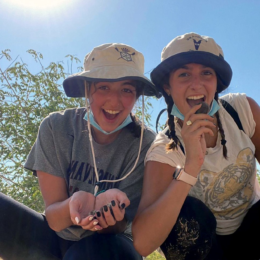 Raquel and a friend volunteering in Israel