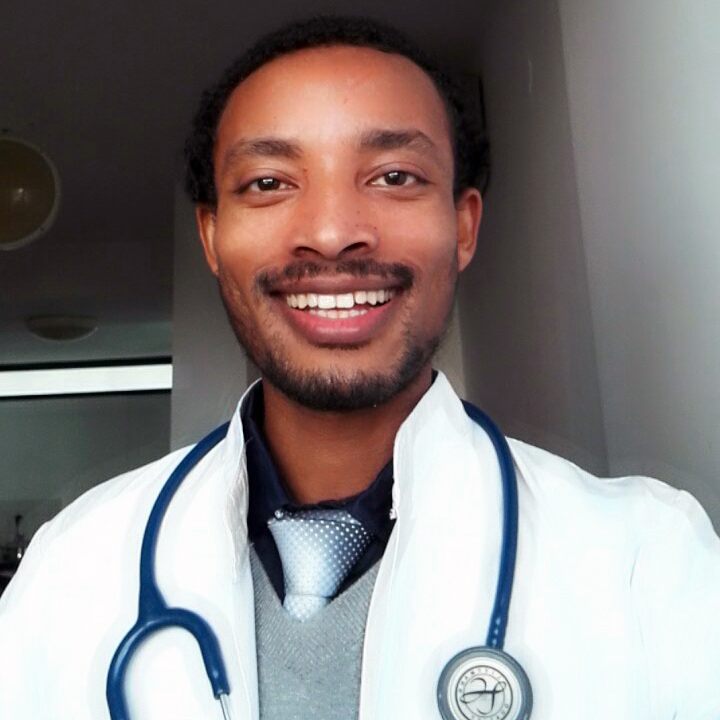 Dr. Masresha in his white coat