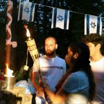 Dvir, Summer Camp Shaliach with a torch