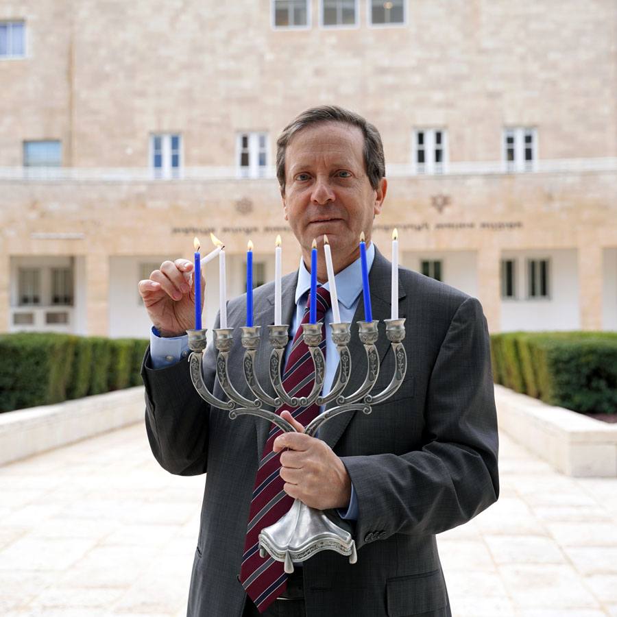 Isaac Herzog lights Hanukkah candles