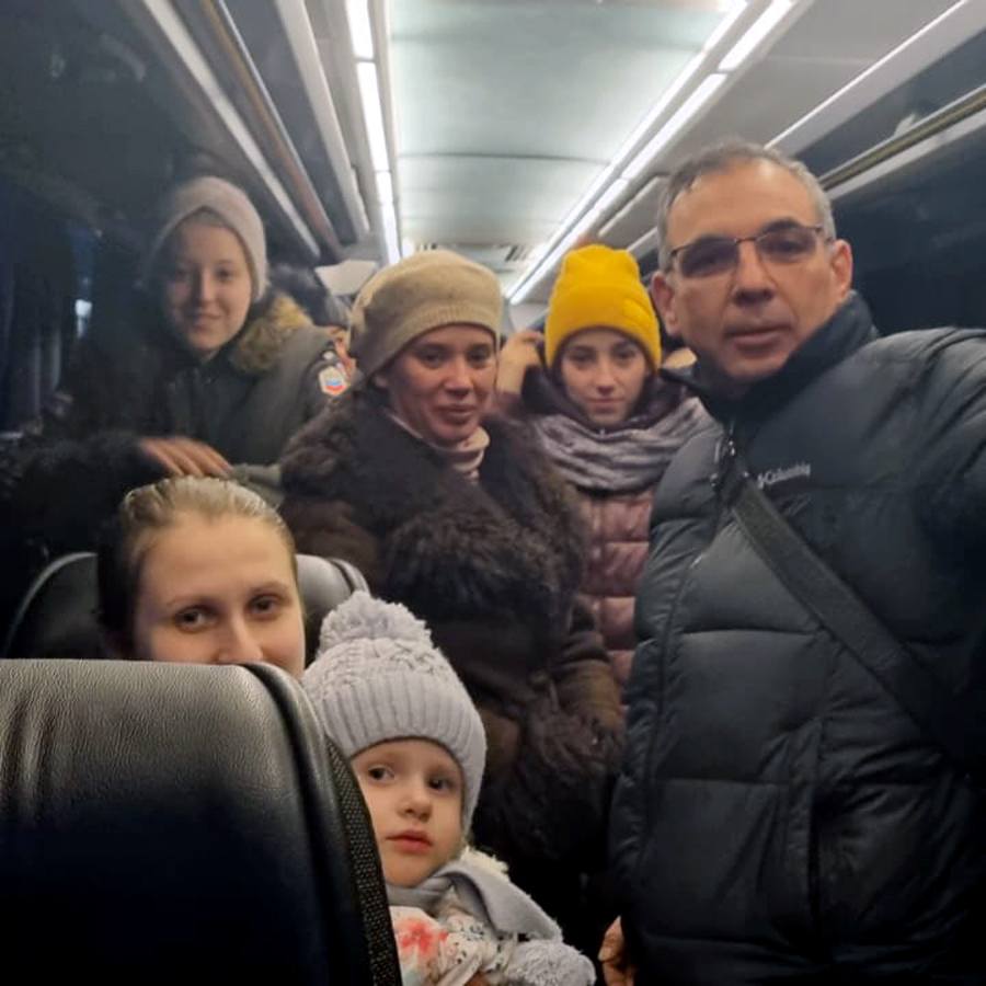 Raffael ‘Rafi’ Heltzer (a Jewish Agency empoyee) with Ukrainian immigrants on a bus