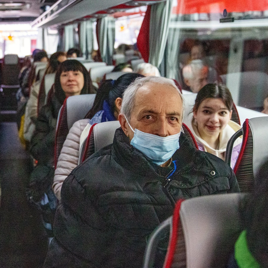 Ukrainian refugees on a bus to safety