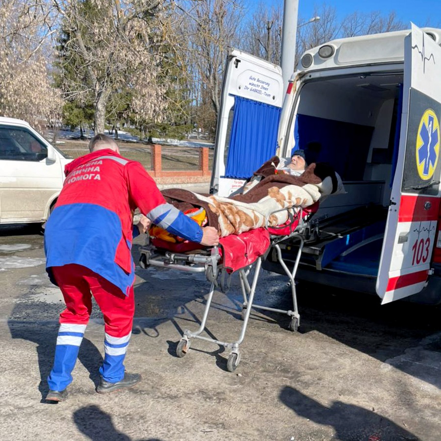 A Ukrainian refugee being loaded into an ambulance