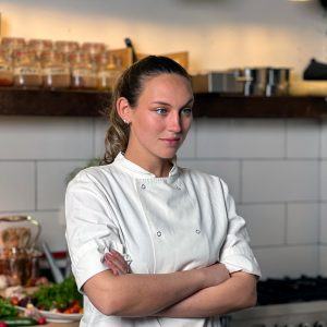 Talia, a Masa participant, in the kitchen