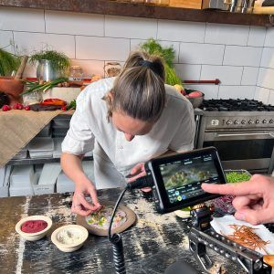 Talia on camera in the kitchen