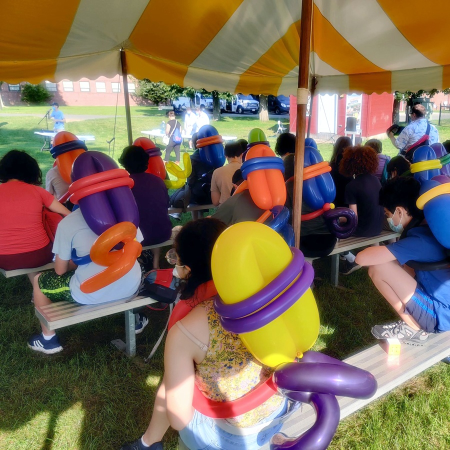 kids learning balloon artistry at summer camp