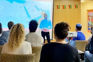 Yonatan speaking at the Sigd event he organized on campus