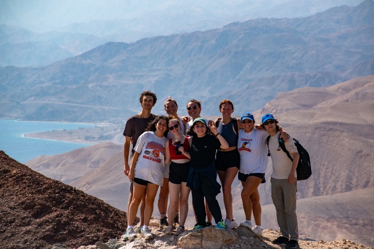 Tisha (center, making a peace sign) with fellow Masa participants on a hike in Israel