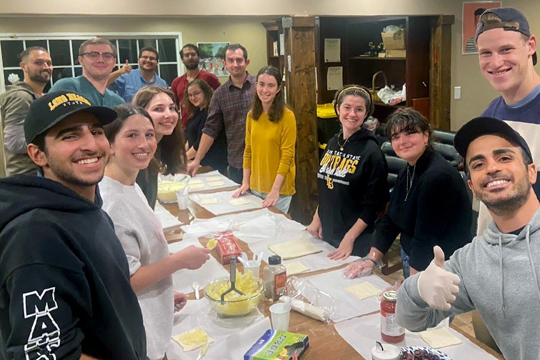 Yarin (front right) with students enjoying a baking activity