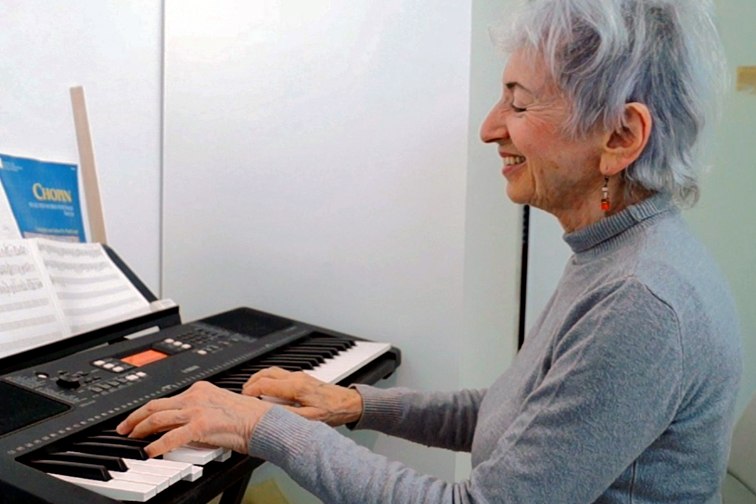 An Amigour resident plays piano