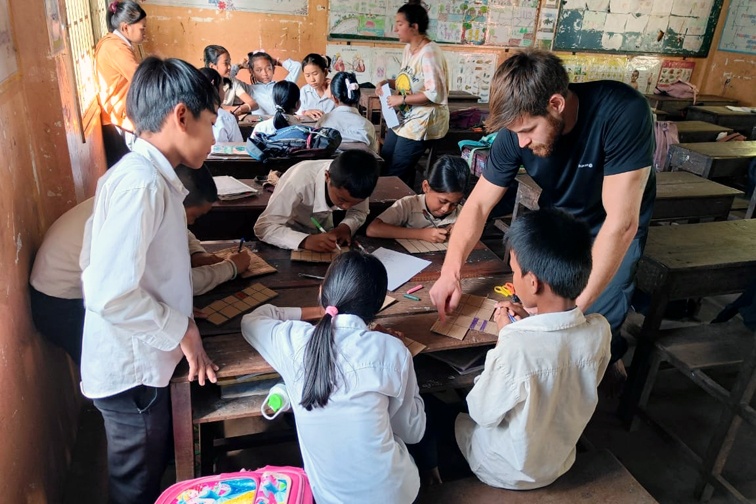 Artemiy with students in Cambodia