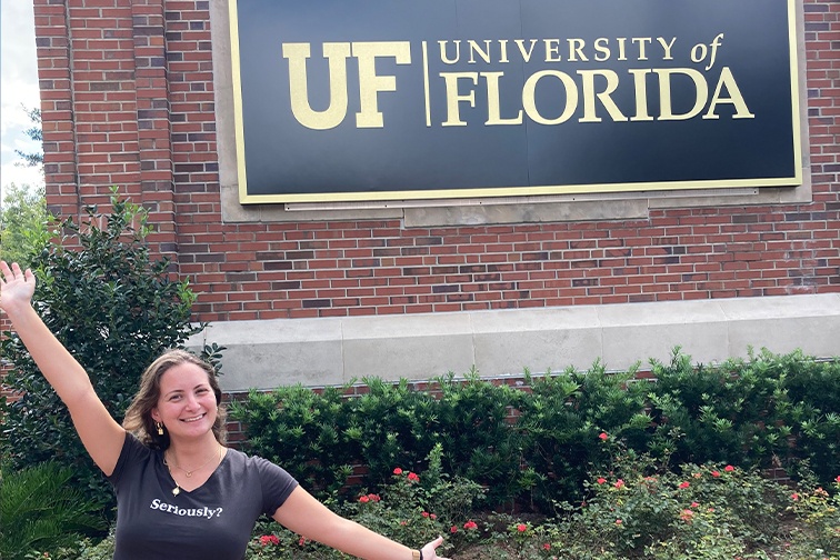 Nofar, Israel Fellow, in front of the University of Florida sign