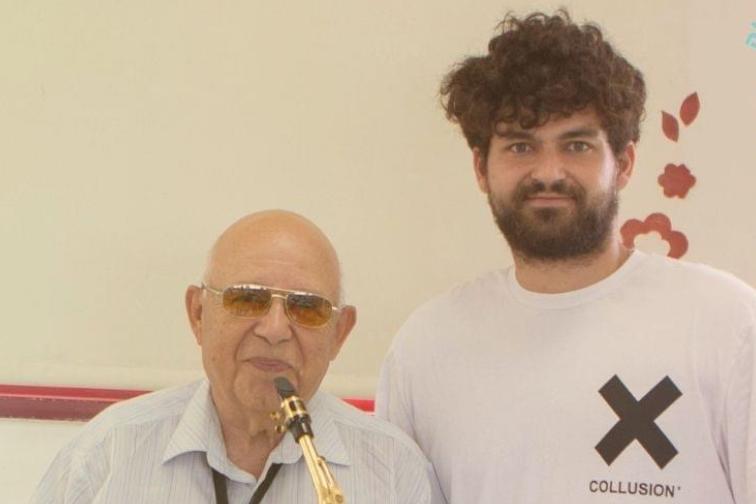 Daniel with an elderly immigrant