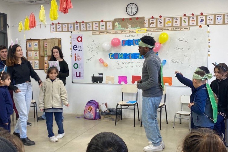 TEN volunteers working with kids at a local school in Buenos Aires