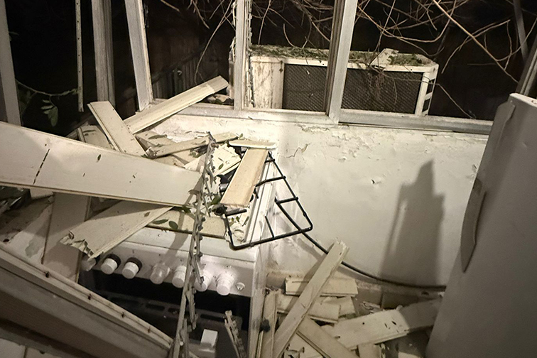 A damaged apartment after a missile strike
