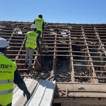 A damaged building is checked out by authorities